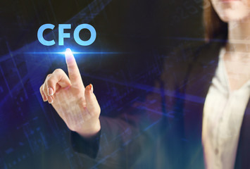 The concept of business, technology, the Internet and the network. A young entrepreneur working on a virtual screen of the future and sees the inscription: CFO
