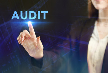 The concept of business, technology, the Internet and the network. A young entrepreneur working on a virtual screen of the future and sees the inscription: Audit