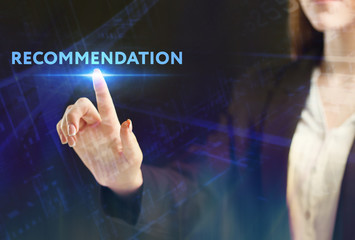 The concept of business, technology, the Internet and the network. A young entrepreneur working on a virtual screen of the future and sees the inscription: Recommendation
