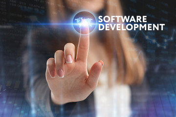 The concept of business, technology, the Internet and the network. A young entrepreneur working on a virtual screen of the future and sees the inscription: Software development