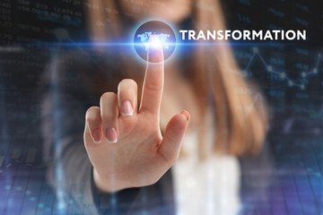 The concept of business, technology, the Internet and the network. A young entrepreneur working on a virtual screen of the future and sees the inscription: Transformation