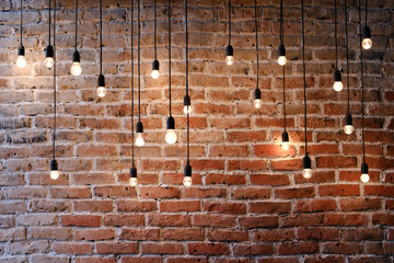 Fototapety  Old brick wall with bulb lights lamp
