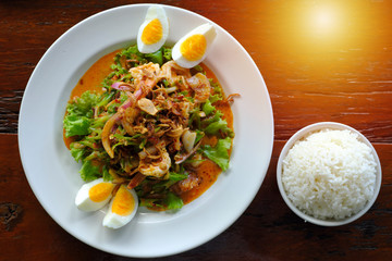 Salad of local vegetables and shrimp with boiled eggs.and rice