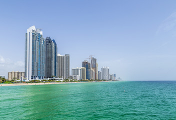view to coastline of Sunny isles Beach, Miami with skyscraper