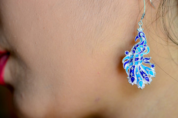 beautiful colorful earring on girl ear,silver  jewelry.