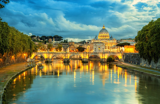 Evening view of Basilica St Peter and bridge Sant Angelo in Vatican City Rome Italy. Rome architecture and landmark.  St. Peter's cathedral in Rome.