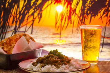 Holiday food, Indian curry with sunset in the background
