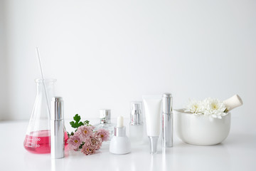 cosmetic skincare beauty product .natural organic flower oil ingredient in the laboratory. packaging spa concept.