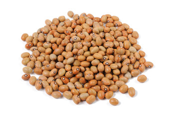 Brown beans are scattered on a white background. View from above.