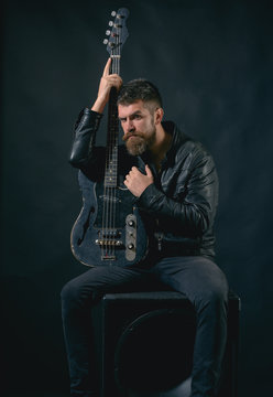 Me and my guitar. Bearded man hold guitar. Punk rock star with beard on serious face. Music is my life. In search of inspiration
