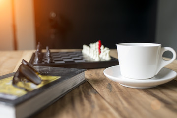 Naklejka na ściany i meble a cup of coffee with blurred Chess