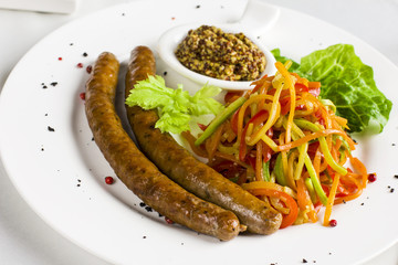 Bavarian grilled sausages with fresh vegetables spaghetti