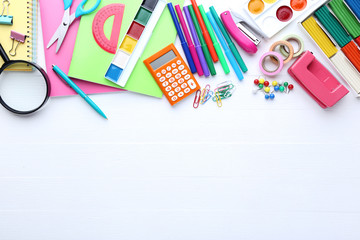 School supplies on white wooden table