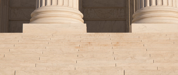 Close up photo of the column bases and steps of the US Supreme Court in Washington, D.C. - obrazy, fototapety, plakaty