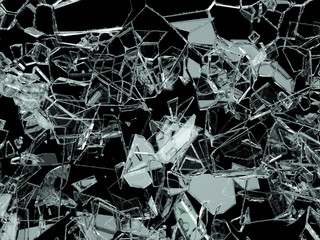 Pieces of shattered or cracked glass on black