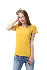 Fototapeta premium Portrait of young woman in yellow t-shirt on white background