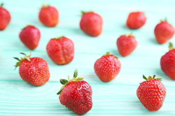 Fresh strawberries on mint wooden table