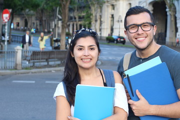 Ecstatic couple of ethnic international students abroad