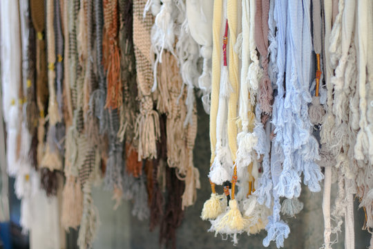 Different handmade laces with tarbush on display in Dubai Marcket shop