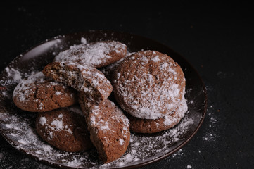 oatmeal cookies on a black table in castor sugar