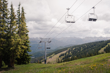 A ski lift with a storm in the back ground in Vail, Colorado. 