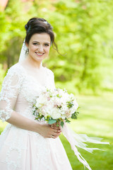Beautiful bride with wedding bouquet 