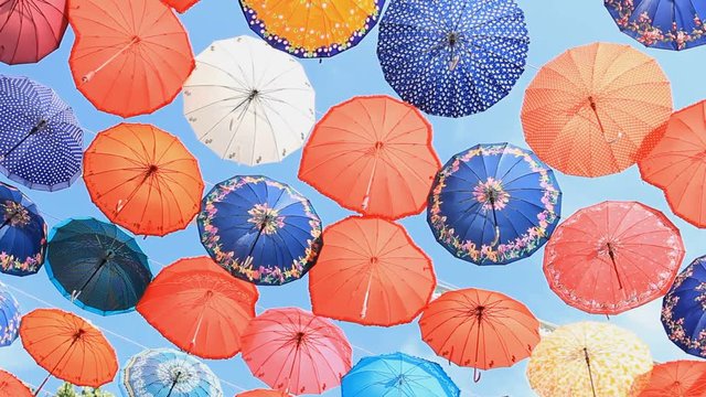 Colorful umbrellas on the blue sky background in Antalya, Turkey