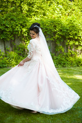 Fototapeta premium Beautiful bride with wedding bouquet 