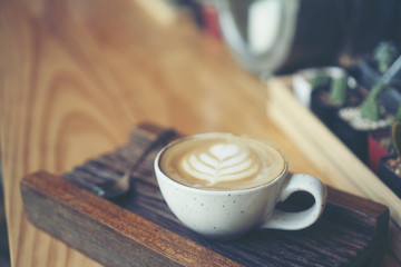 Cup of coffee latte in coffee shop