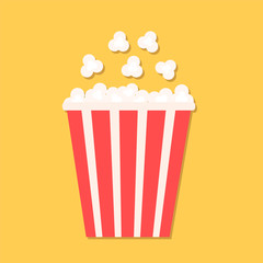 Popcorn in red paper cup. Cinema icon in flat dsign style