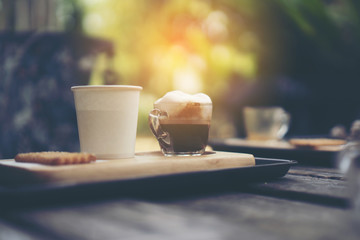 Coffee cup in coffee shop - vintage style effect picture