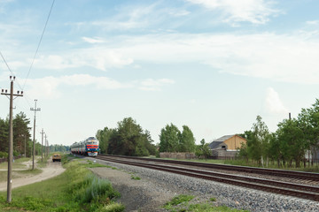 arrival of the train against the background of nature, railway public transport