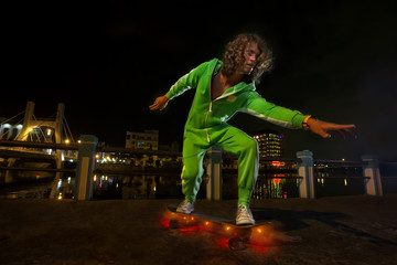 skateboarder jump at night