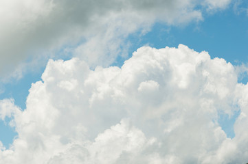 White cumulus clouds against the blue sky. The concept of weather