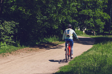 Obraz premium The cyclist in motion riding bicycle road