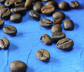 Coffee beans on a blue background