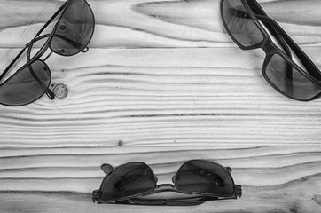 Sunglasses on a wooden table.