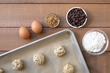 Flat lay of chocolate chip cookie dough baking scene