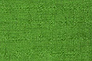 Green fabric texture background. Empty abstract cloth backdrop