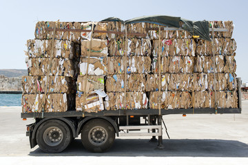 A view of a truck with recycled papers and cartoons in the customs of Kos, Greece