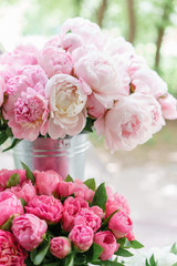 Lovely flowers in glass vase. Beautiful bouquet of pink peonies . Floral composition, scene, daylight. Wallpaper