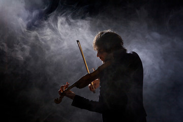 Classical musician violinist with a musical instrument