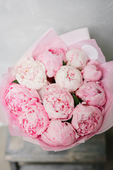 Lovely flowers in glass vase. Beautiful bouquet of pink peonies . Floral composition, scene, daylight. Wallpaper