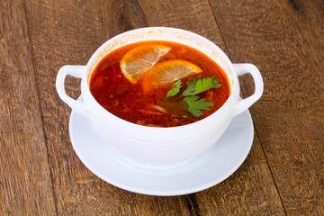 Solyanka soup with lemon