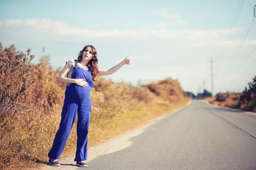 Pregnant woman hitchhiking the car