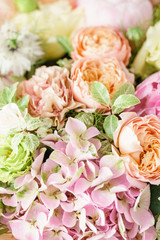 beautiful spring bouquet. flower arrangement with hydrangea and peonies. Color light pink. The concept of a flower shop, a small family business