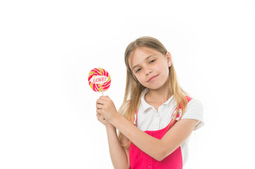 Girl with lollipop isolated on white. Little child hold candy with love lettering. Sweet beauty and look. Valentines day romance. Candyshop concept. Childhood and happiness. Sharing sweet love