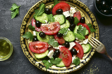 Vegetable salad with feta cheese - traditional dish of greek cuisine.Top view .