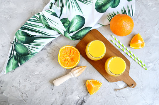 Fresh Orange Juice in the Glass Summer Morning Drink Beverage Gray Background Vitamins