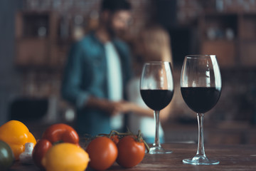kitchen background with wine and two glasses.